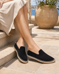 Woman wearing black espadrille