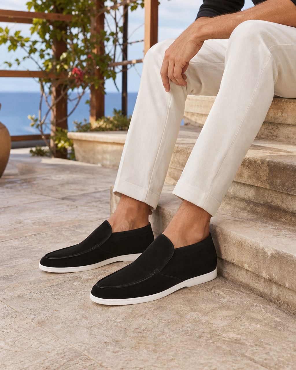 Man wearing black high top with linen trousers