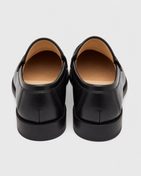 Black penny heel view