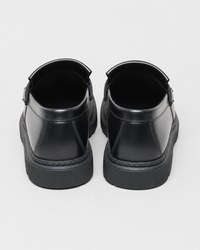 Black penny heel view