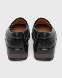 Black platform heel view