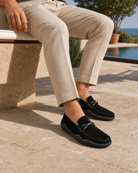 Man wearing black slip on