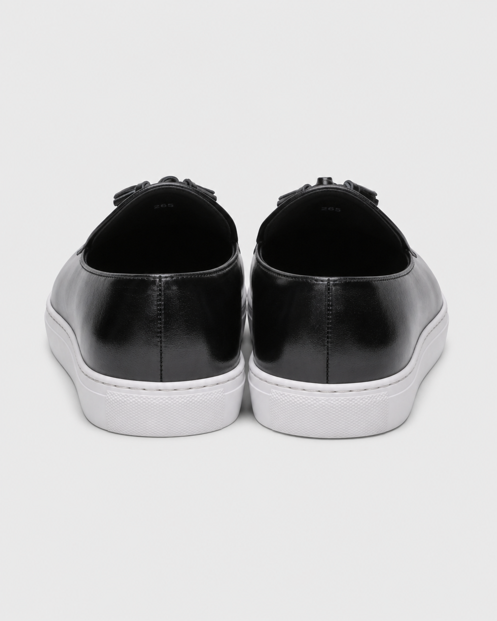 Black tassel heel view