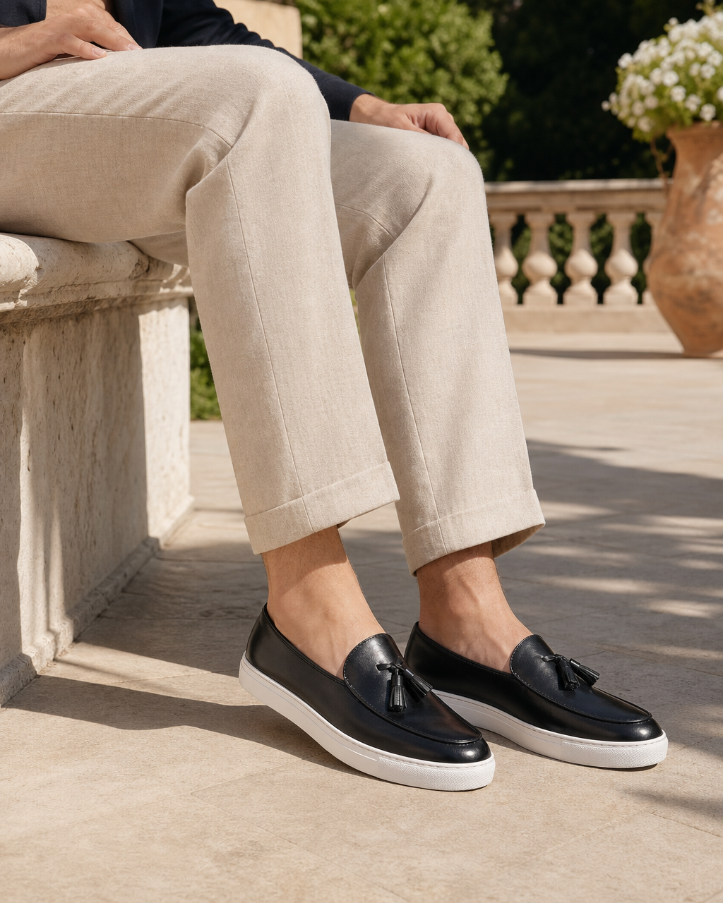 Man wearing black tassel with linen trousers