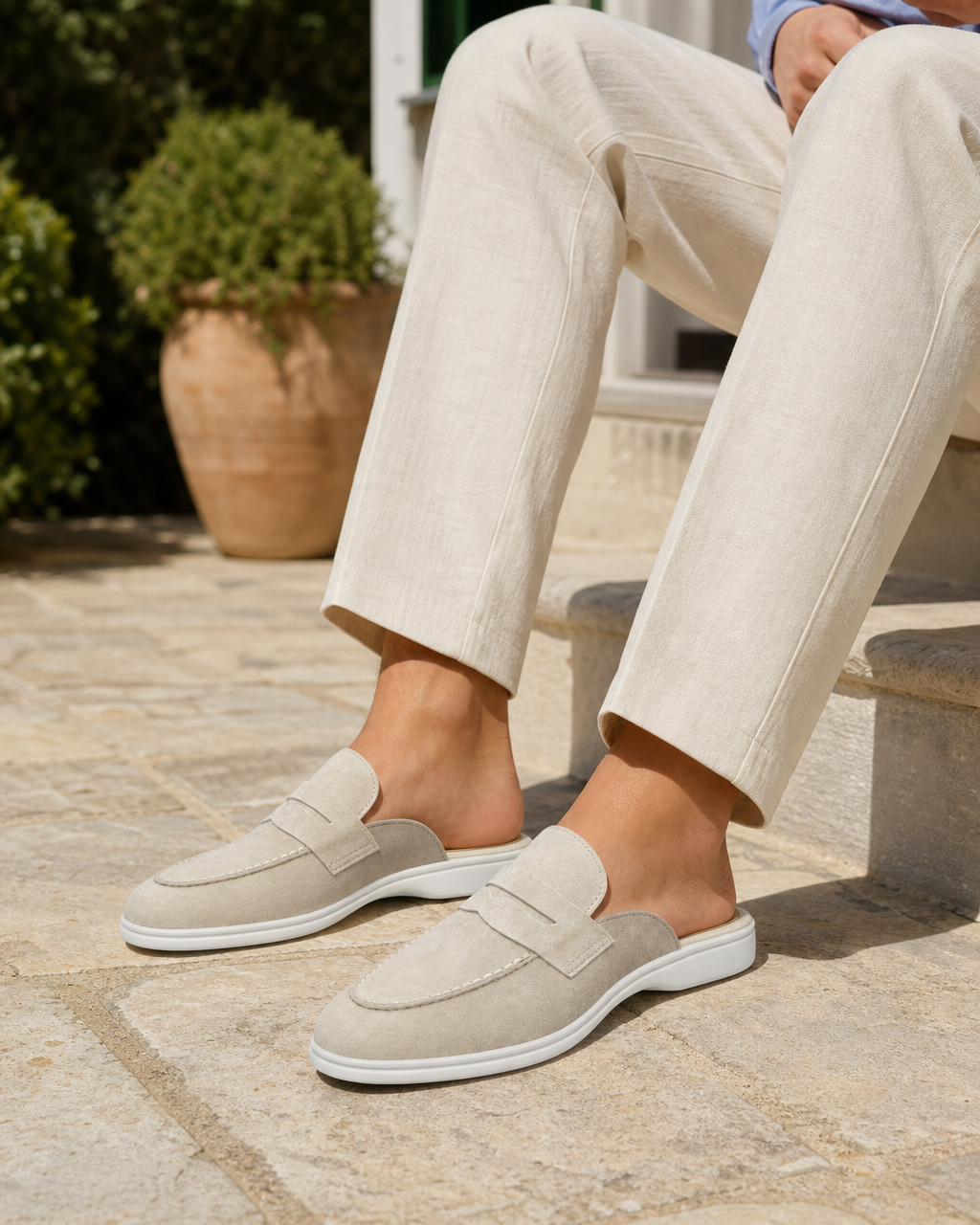 Man wearing cream backless with linen trousers