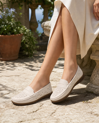 Woman wearing cream platform with a linen midi skirt