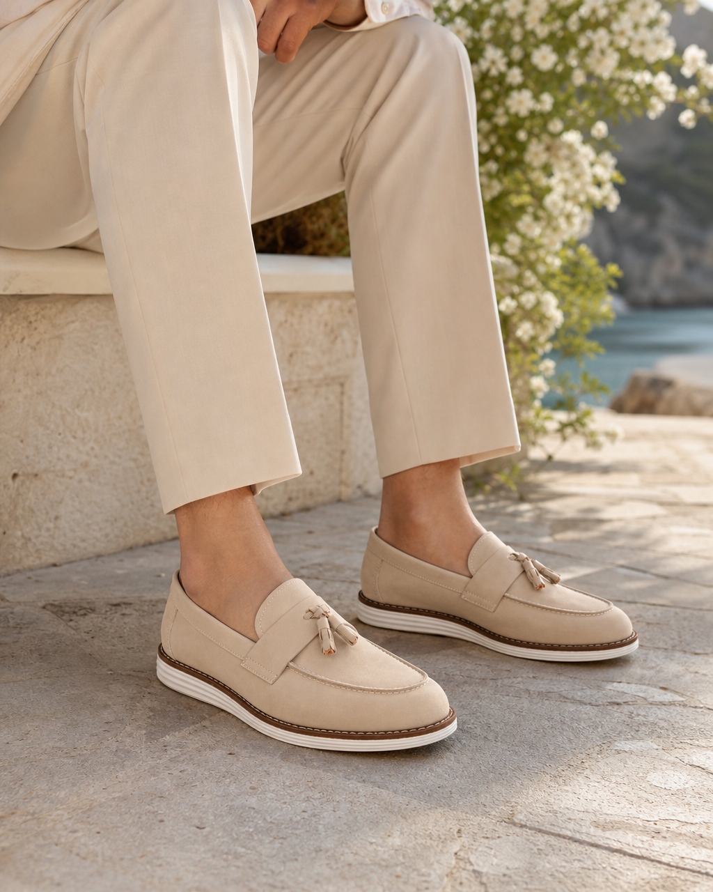 Man wearing cream tassel with linen trousers