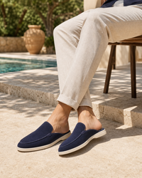 Man wearing navy backless with linen trousers