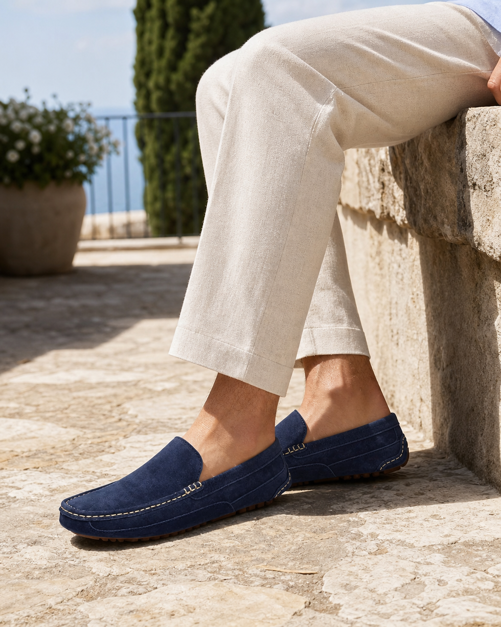 Man wearing navy slip on with linen trousers